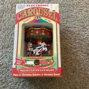 Electronic animated musical carousel with lights and music